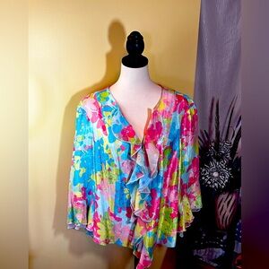 Floral print blouse with 3/4 length bell sleeves. Ruffled v neck blouse.